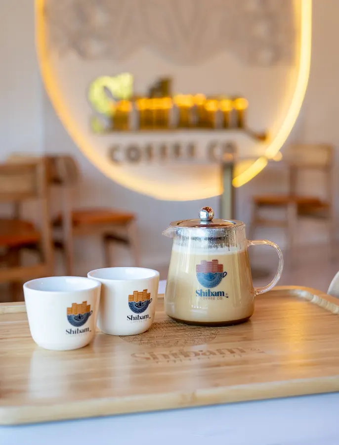 Coffee cups and serving pot at Shibam Coffee